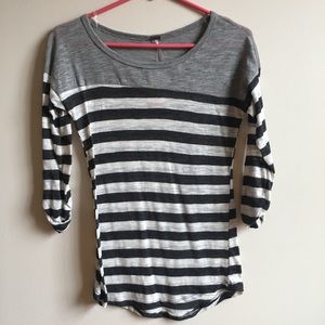 Gray and cream striped quarter length top.